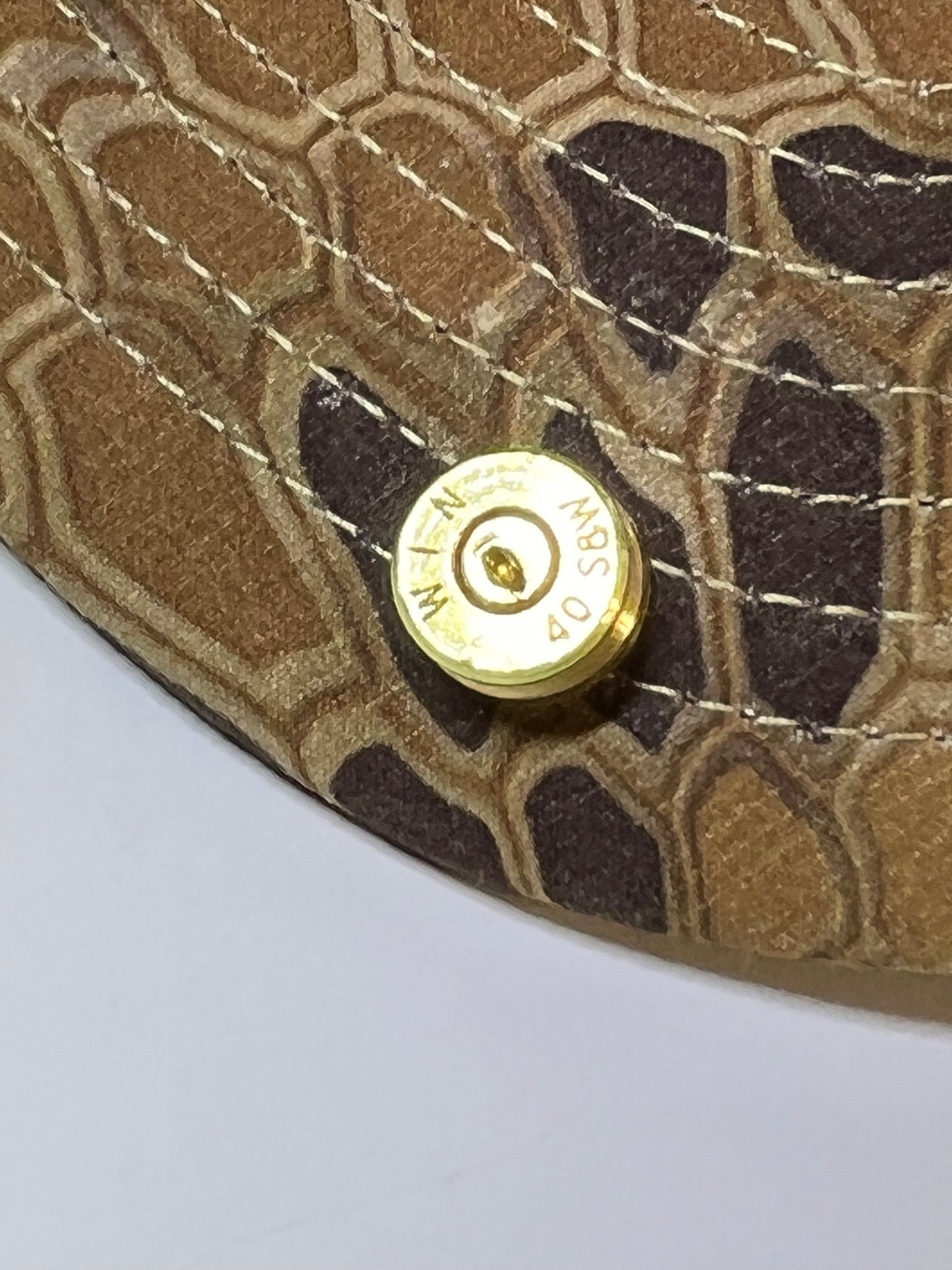 Brass hat tac or tie tac 40 S&W bullet case